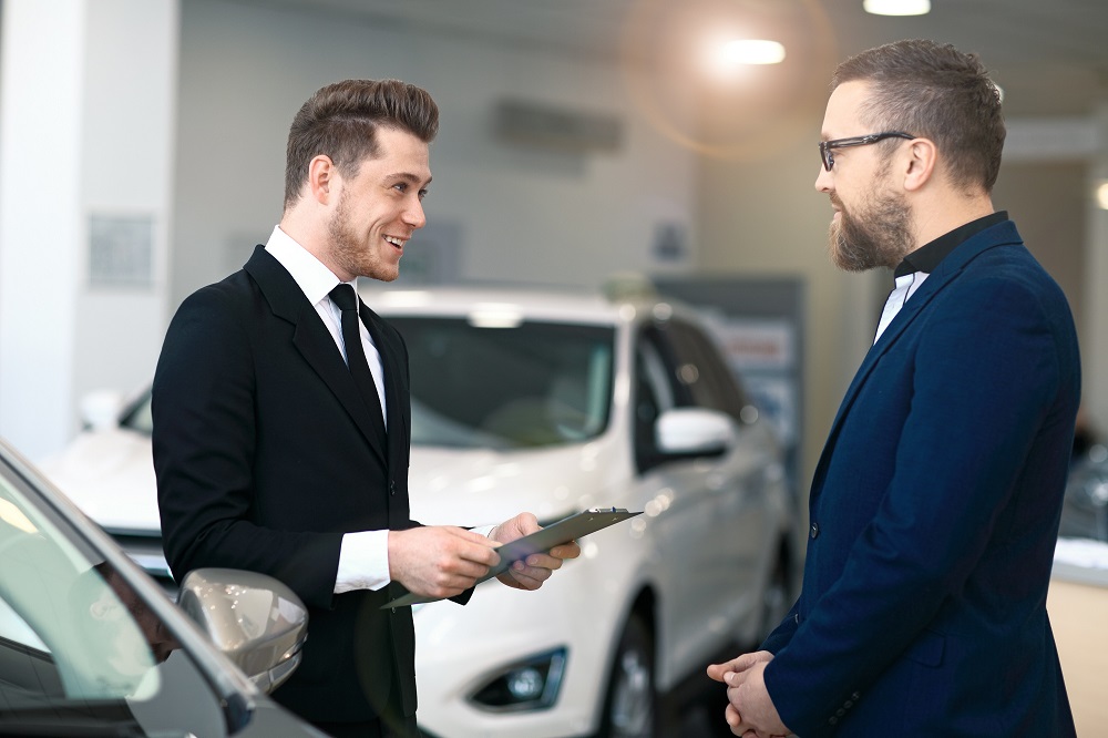 auto tags service provider speaking to customer