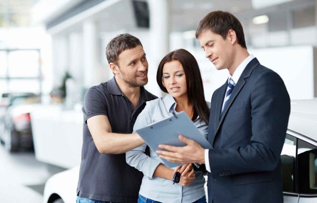 auto tag provider helping customer with paper work