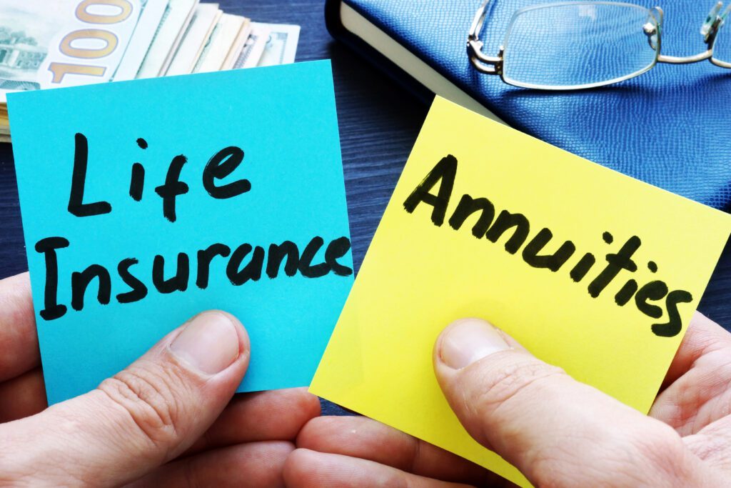 Man holding memo sticks. Life Insurance vs. Annuities.