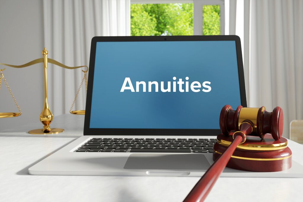 Annuities – Law, Judgment, Web. Laptop in the office with term