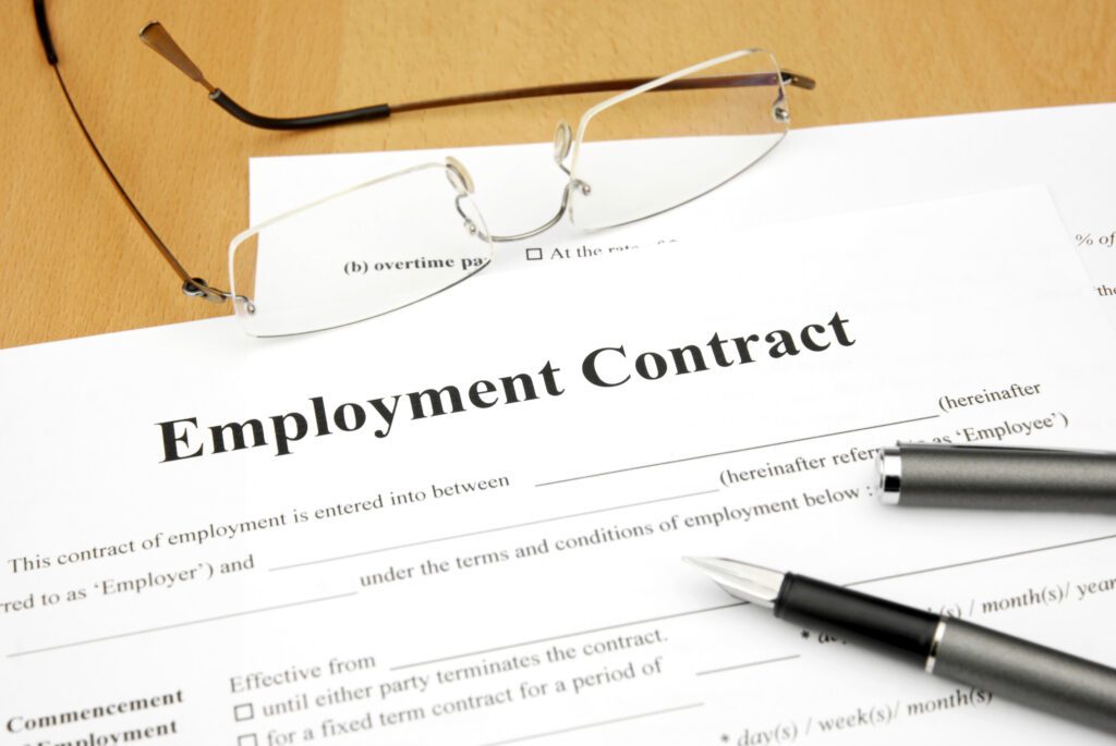 employment contract form with glasses and filler